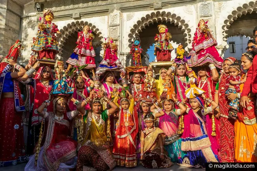 Women carrying Gangaur idols during festival in Marwar