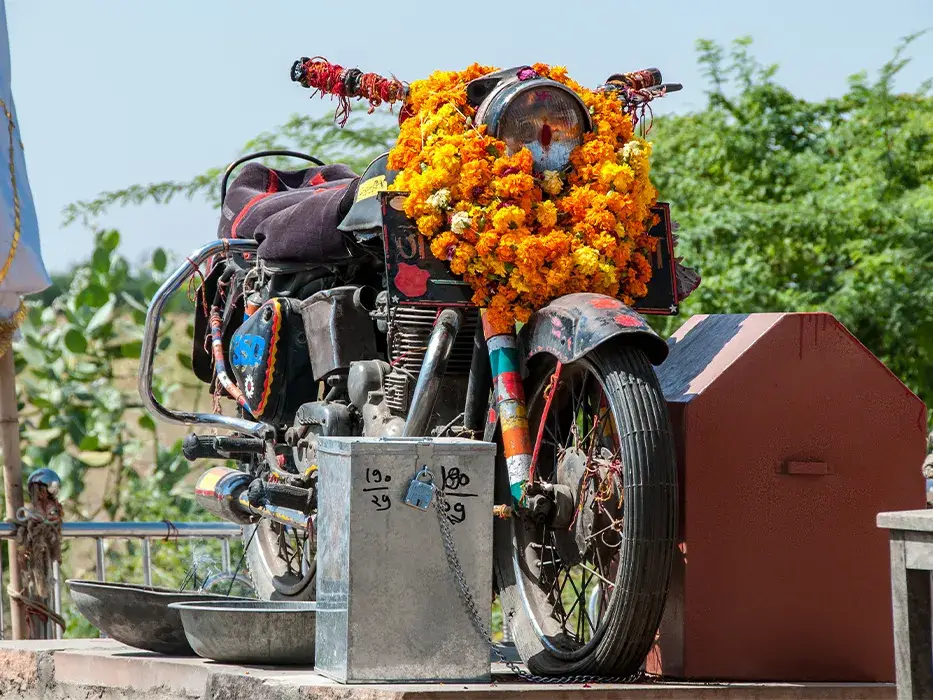 Royal Enfield Bullet placed inside the glass case at Om Banna Dham
